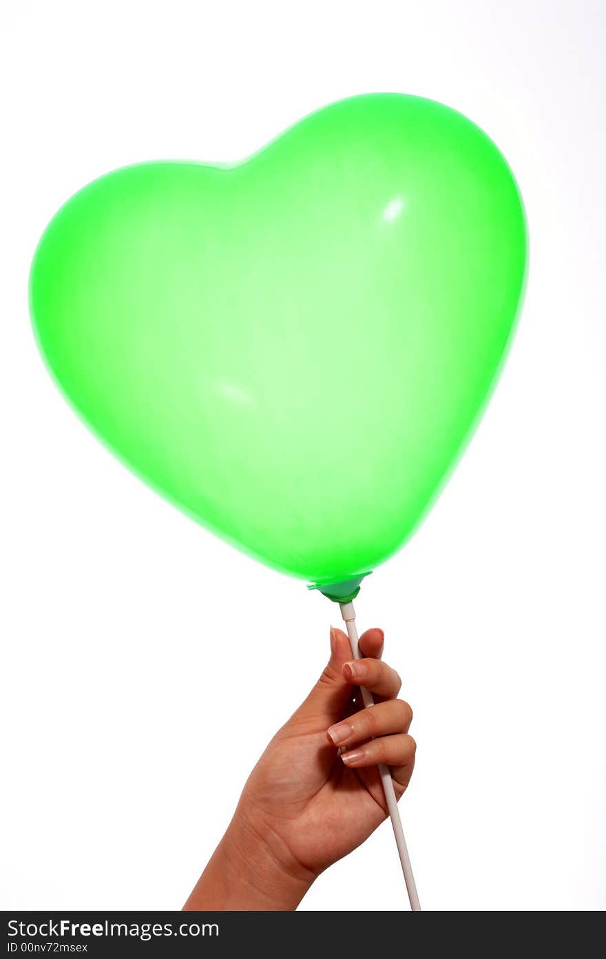 A green balloon on stick