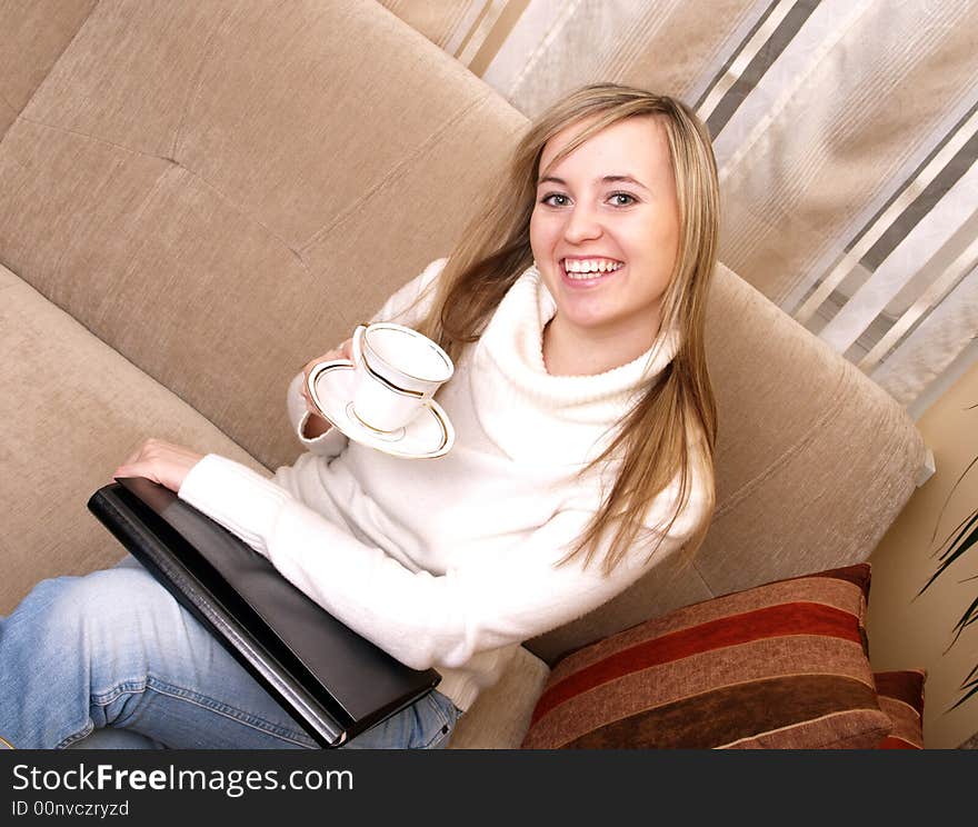 Woman on the couch with coffee