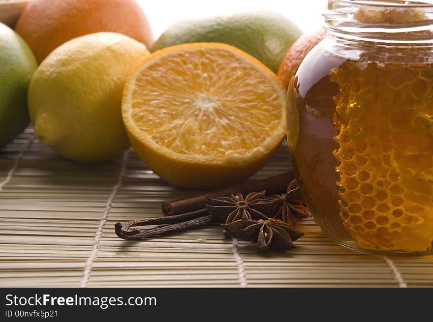 Fresh honey with honeycomb, lemons, oranges, cinnamon, vanilla, anise star. Fresh honey with honeycomb, lemons, oranges, cinnamon, vanilla, anise star