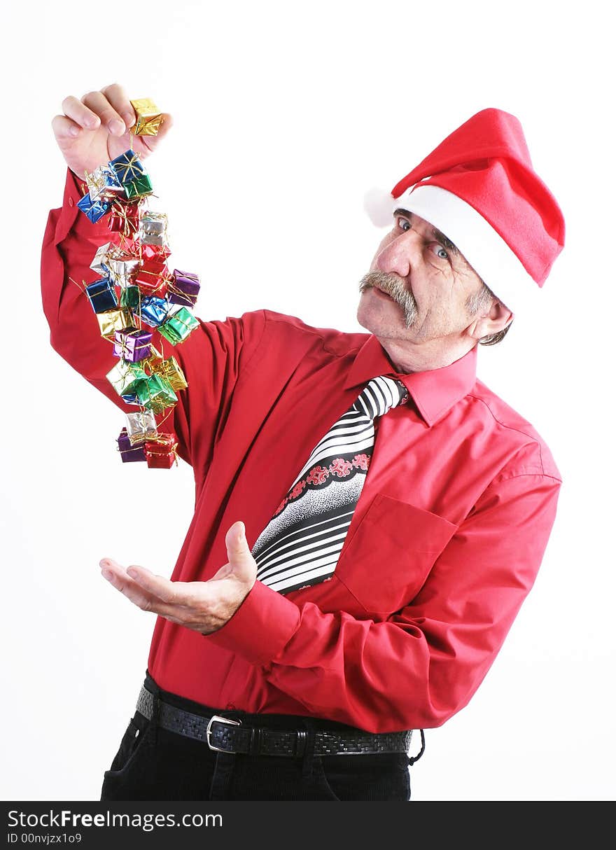 Businessman with Christmas gift and Santa Claus hat. Businessman with Christmas gift and Santa Claus hat.