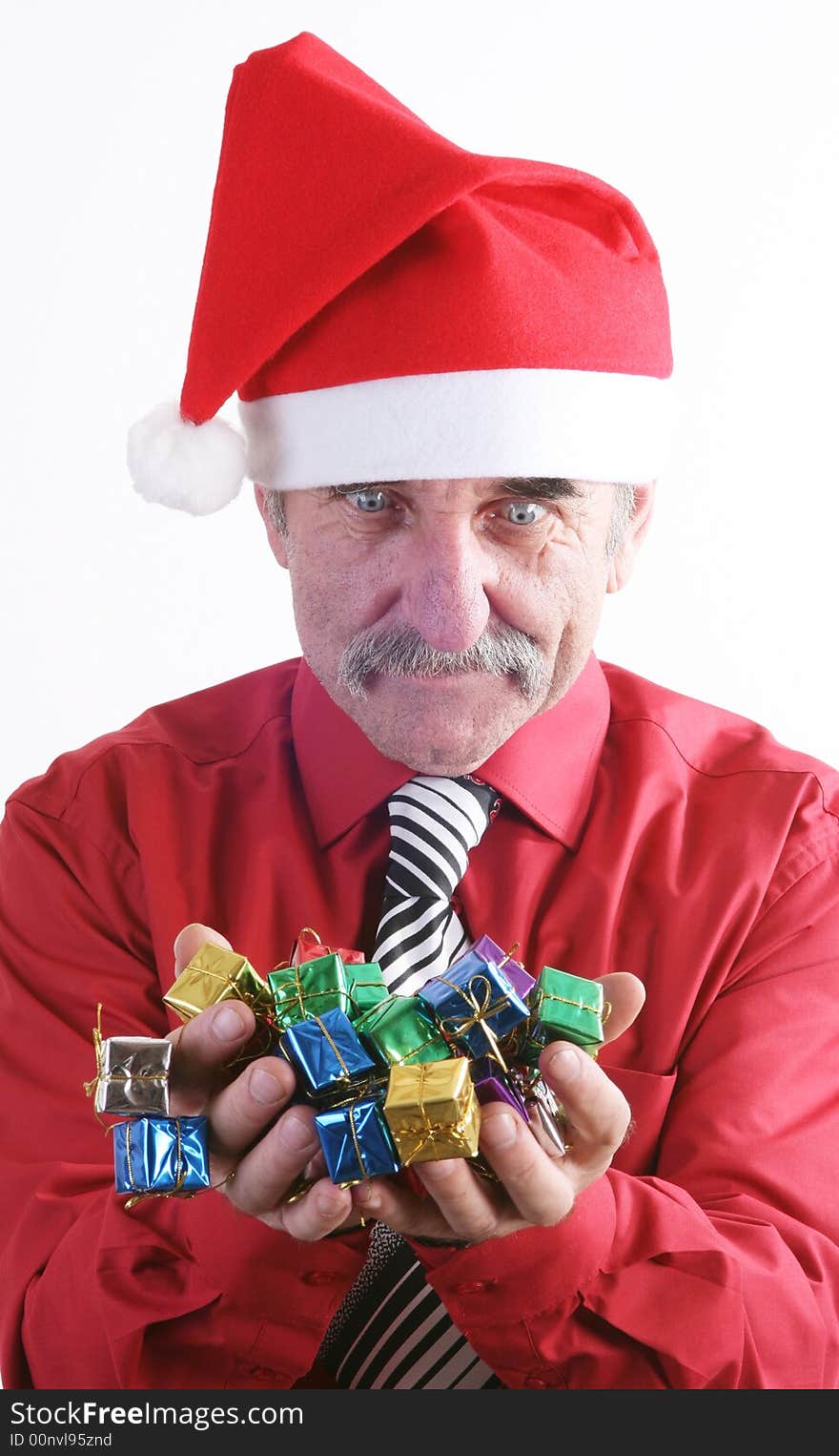 Businessman with Christmas gift and Santa Claus hat. Businessman with Christmas gift and Santa Claus hat.