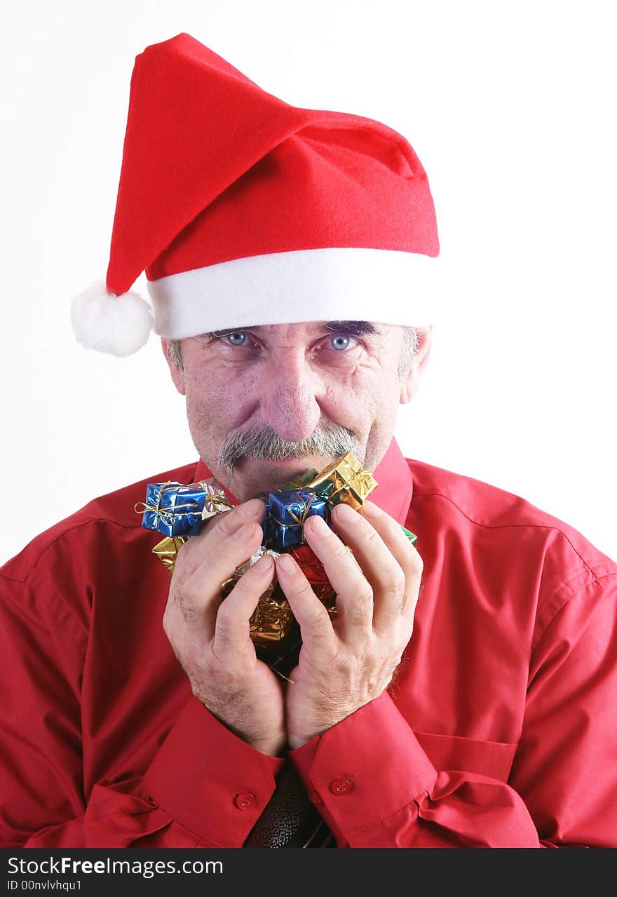 Businessman with Christmas gift and Santa Claus hat. Businessman with Christmas gift and Santa Claus hat.