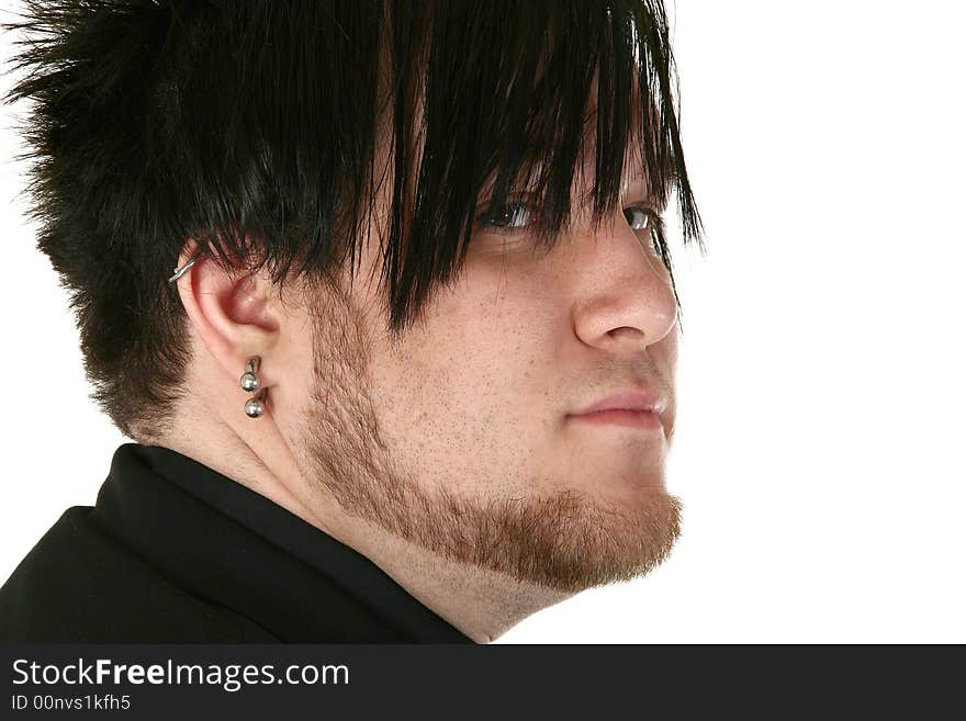 Attractive 24 Year old man over white background with gauge ear ring. Attractive 24 Year old man over white background with gauge ear ring.