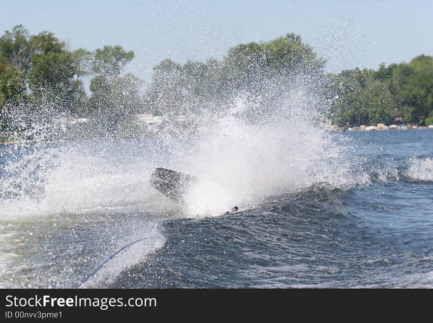 Boy on wakeboard wiping out. Boy on wakeboard wiping out