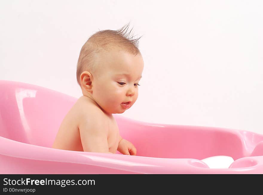 Sweet baby girl in tub on white background. Sweet baby girl in tub on white background