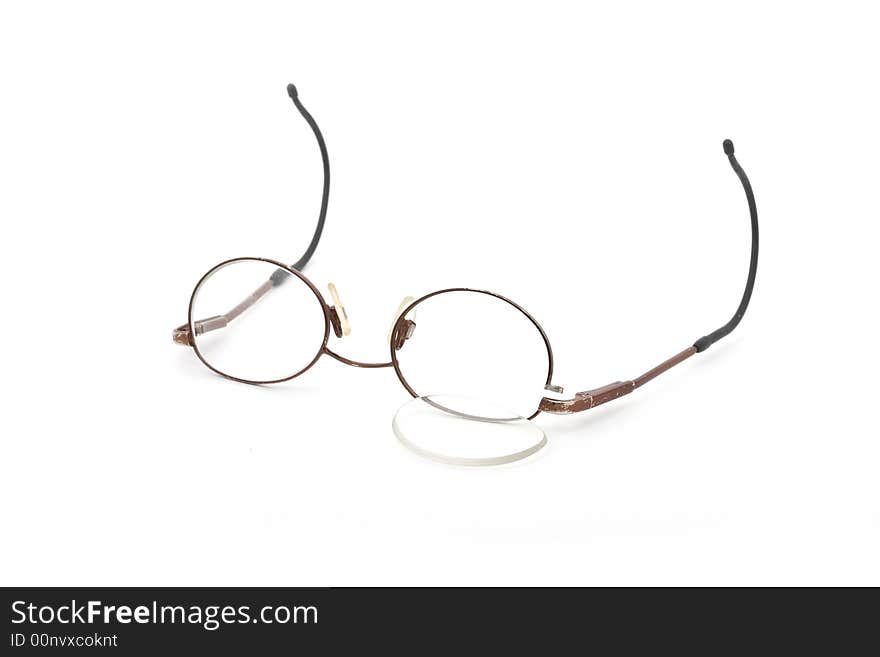 Children's broken eyeglasses isolated on white