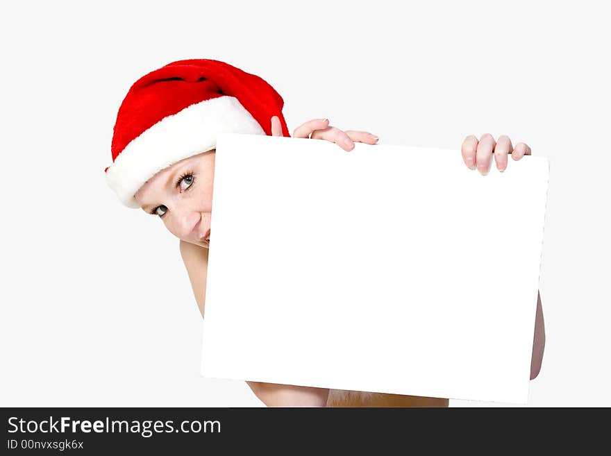 Beautiful girl in christmas bikini and with christmas hat is holding up a white sign for copy space. With background clipping path for your convenience. Beautiful girl in christmas bikini and with christmas hat is holding up a white sign for copy space. With background clipping path for your convenience