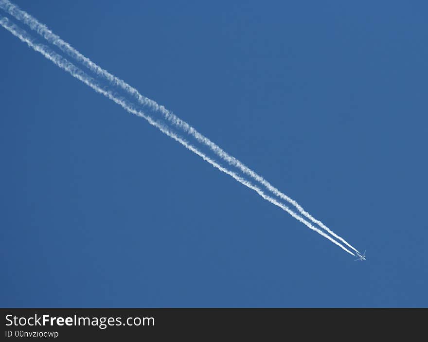 Trail of the commercial airplane on the sky.