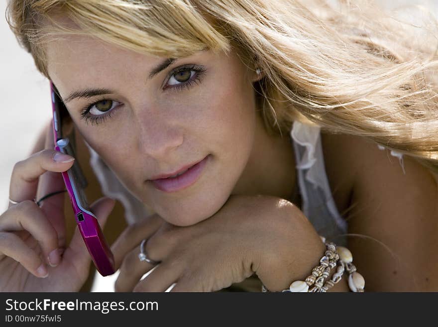 Blonde woman with mobilephone outdoor