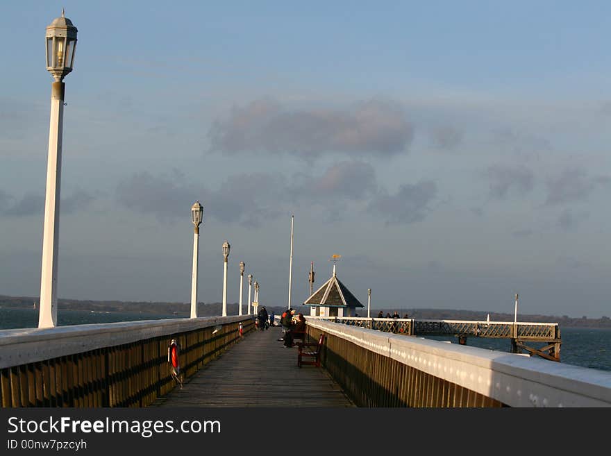 Seaside pier with fishermen