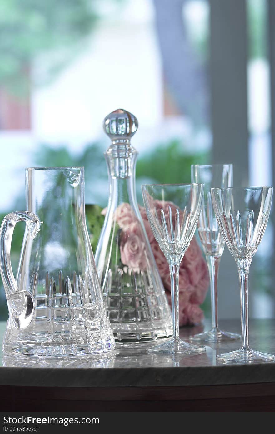 Empty glass recipients on a table, interior day. Empty glass recipients on a table, interior day