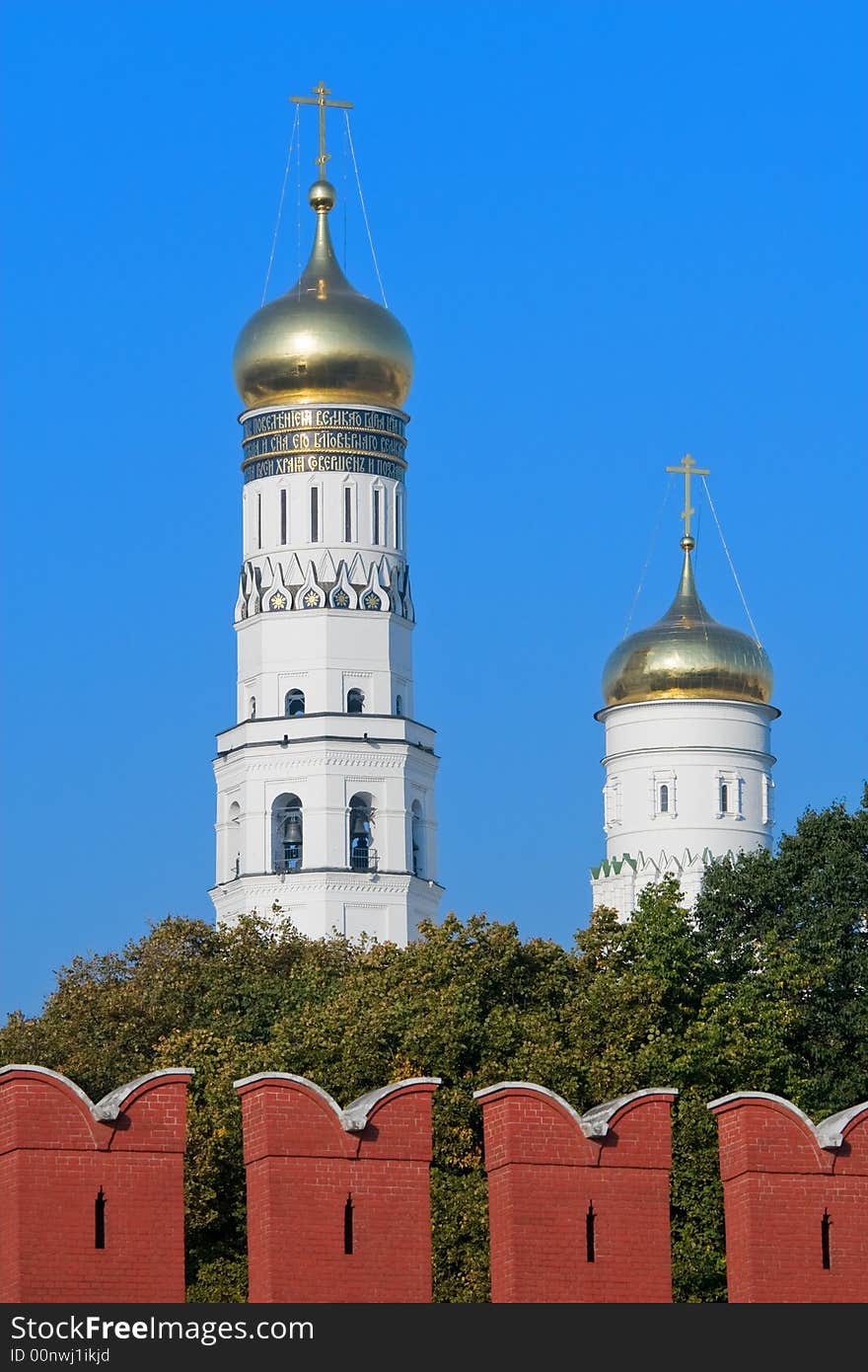 Moscow Kremlin domes under red kremlin wall