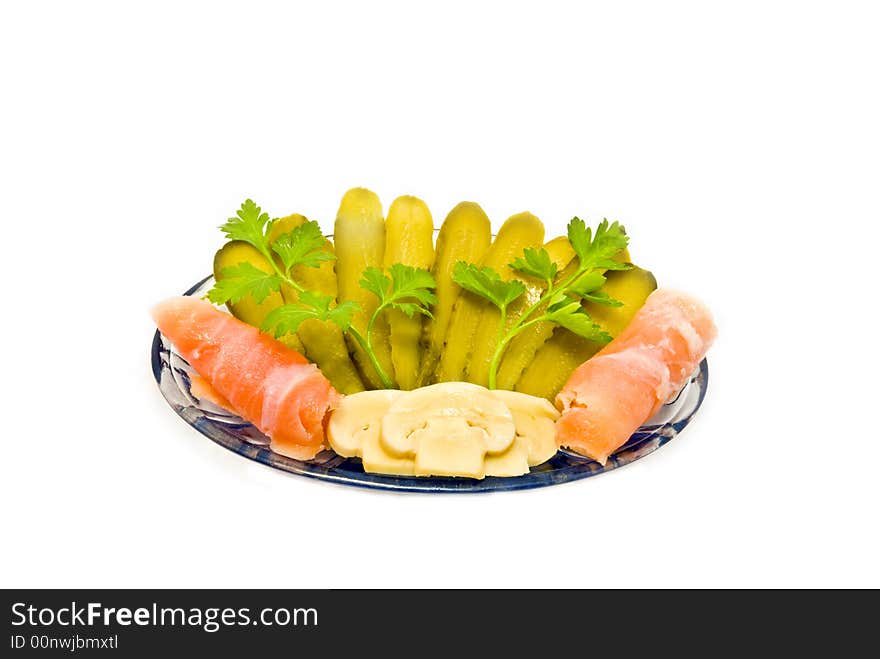 Cucumbers, fish and mushrooms with greenery  on a white background