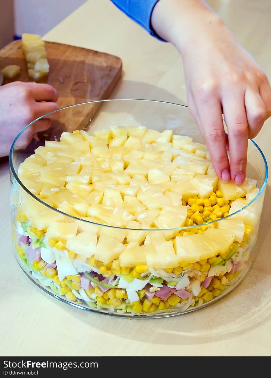 Preparation of layer salad. Putting last layer. Preparation of layer salad. Putting last layer.