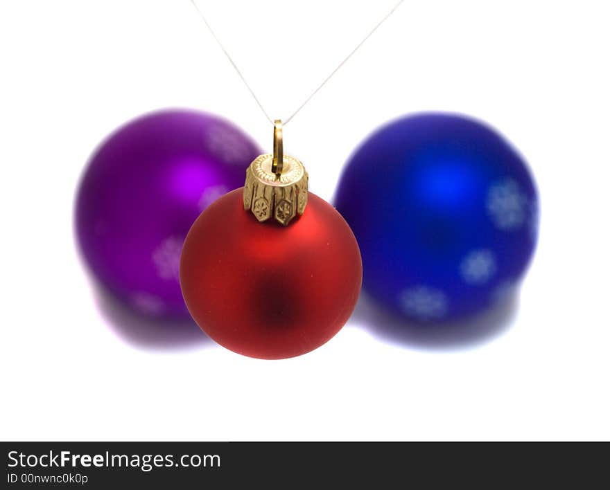 Red fir ball over two another balls