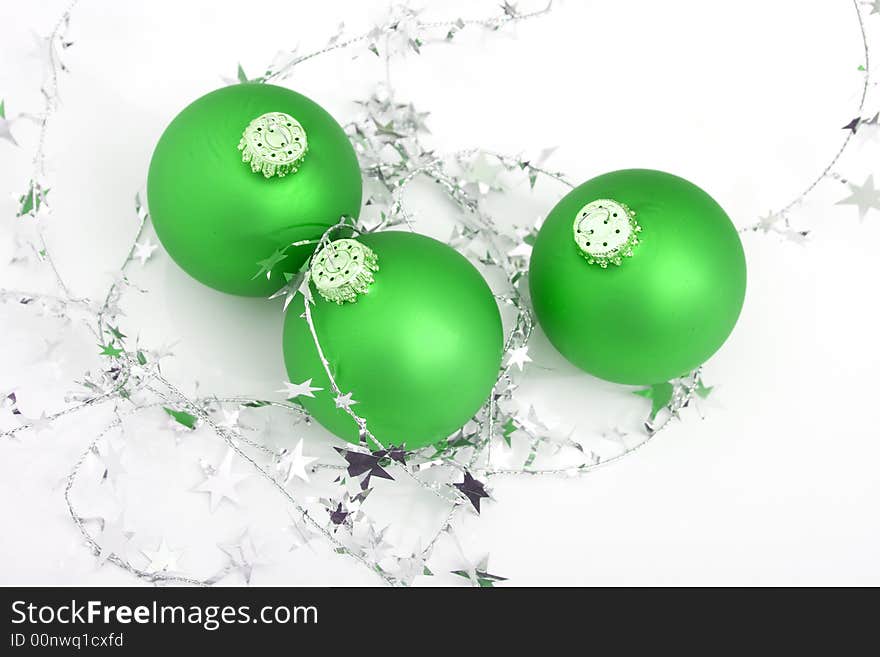 Green ornament with silver stars isolated against white background. Green ornament with silver stars isolated against white background