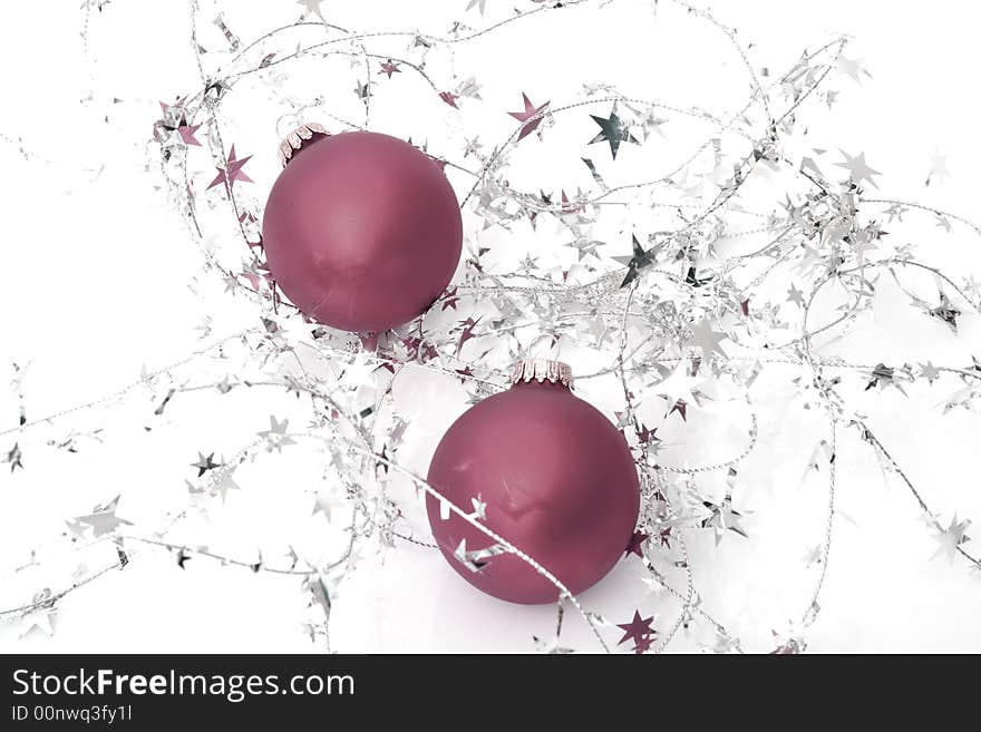 Two red ornaments with stars isolated on a white background