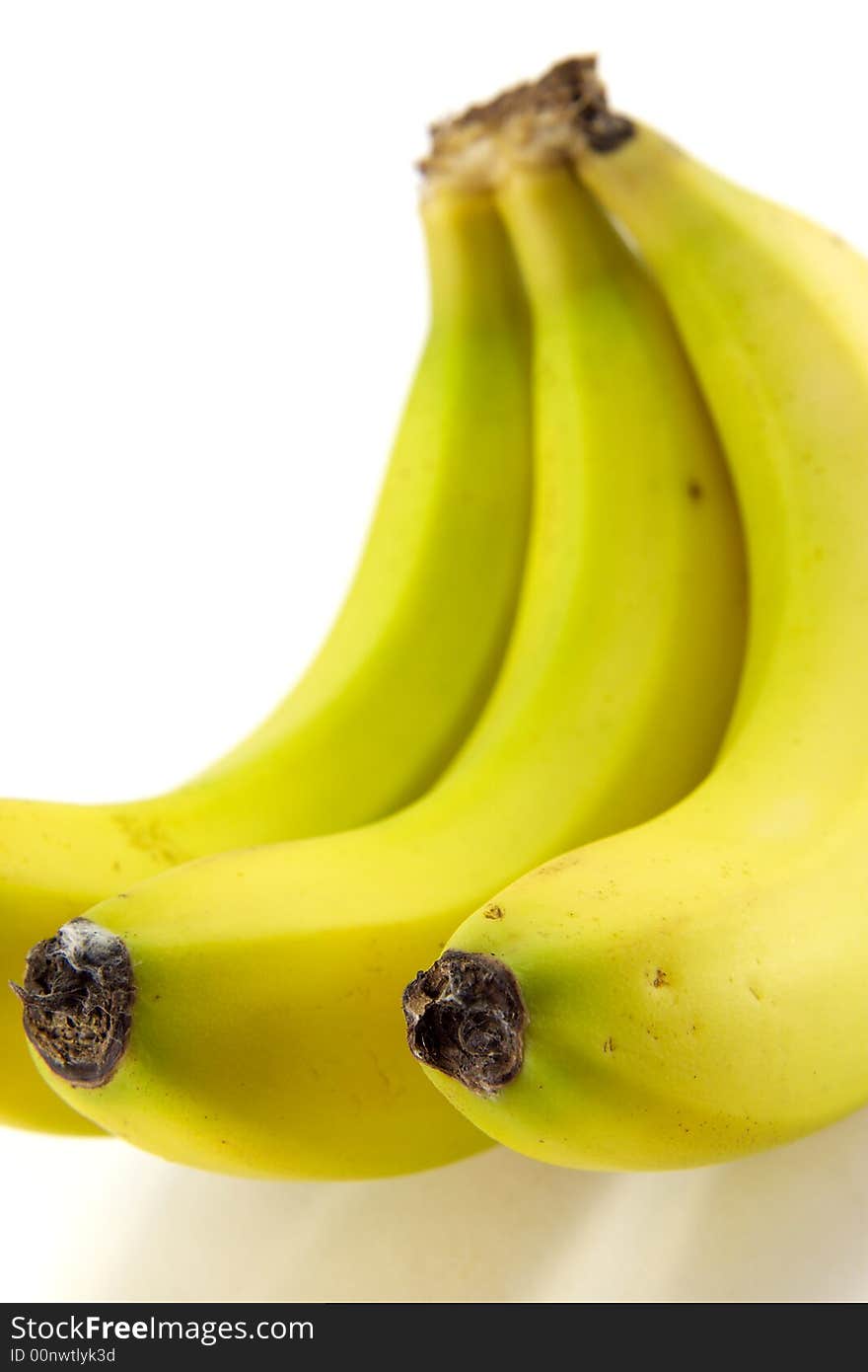 A hand of ripe bananas on white background.