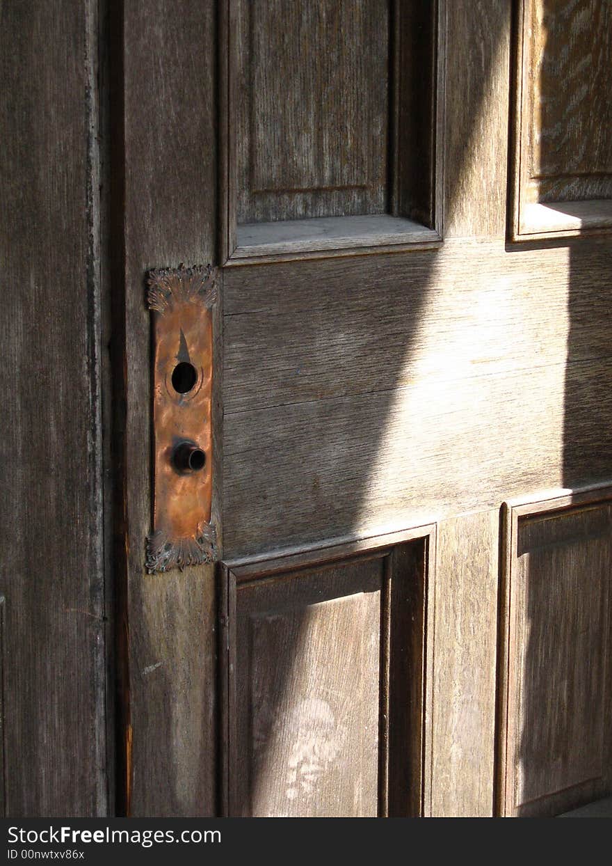 Wooden door w/copper key plate. Wooden door w/copper key plate