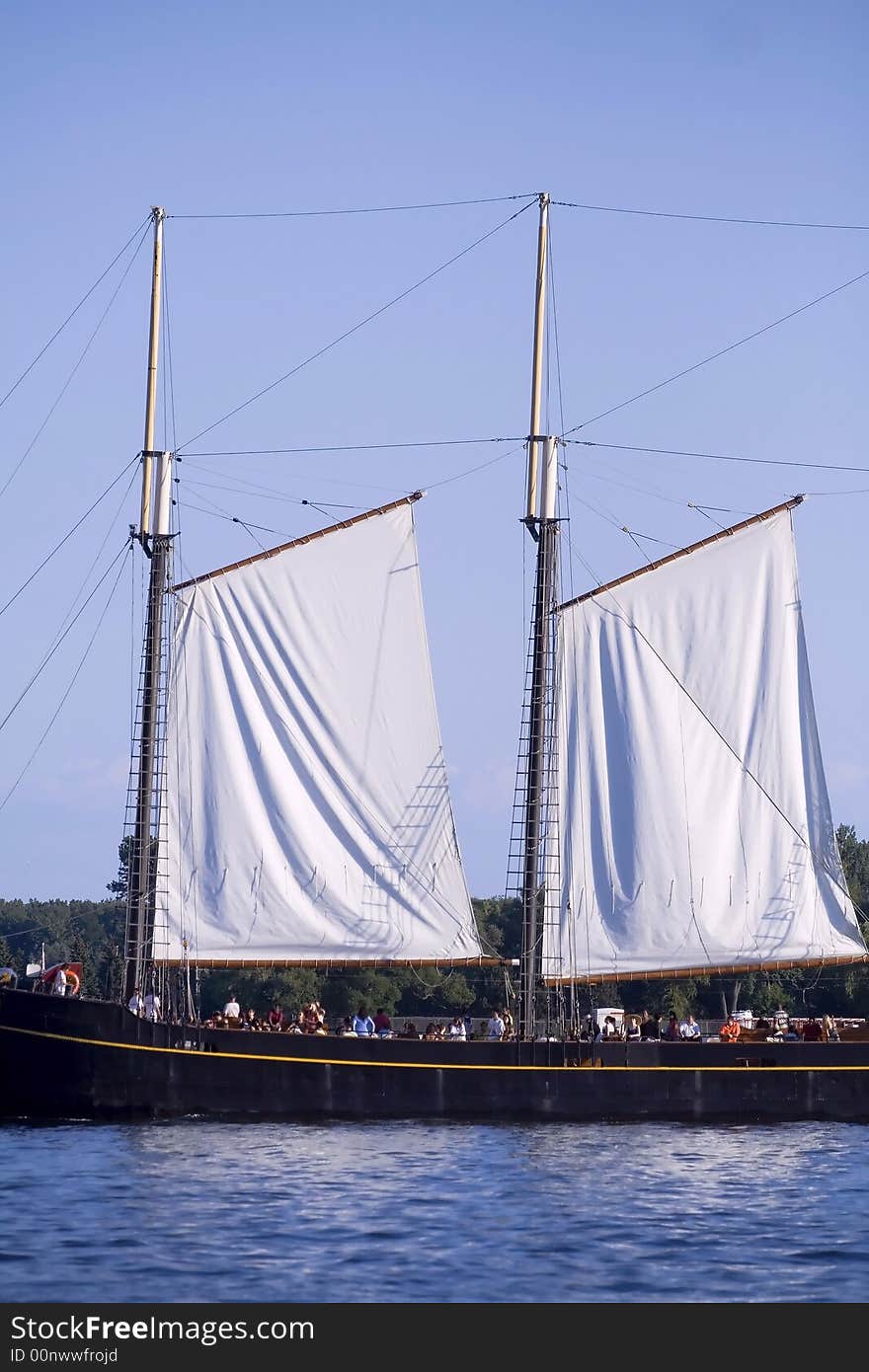 Tall ship with white sail