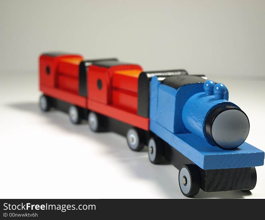 Wooden toy train on white background