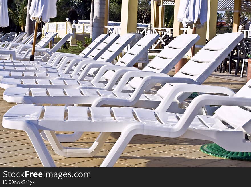 Caribbean holidays pool chairs tropics