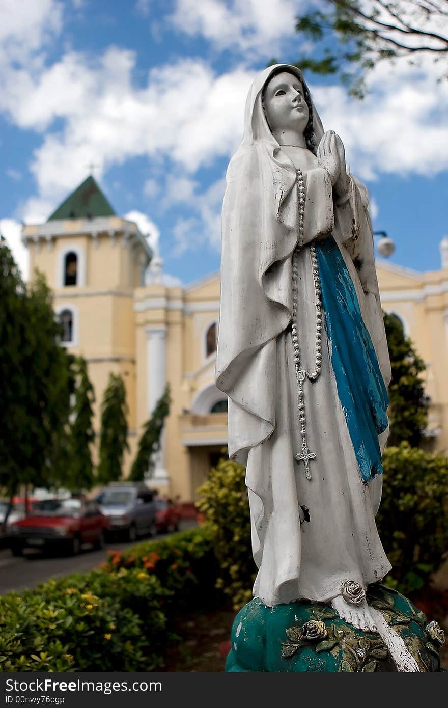 An image of the Virgin Mary outside of a church. An image of the Virgin Mary outside of a church