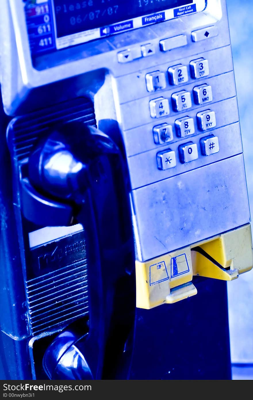 Pay phone close up blue