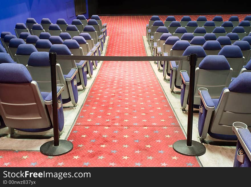 Empty cinema auditorium with black cordon