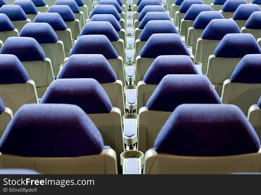 Empty cinema auditorium with blue chairs