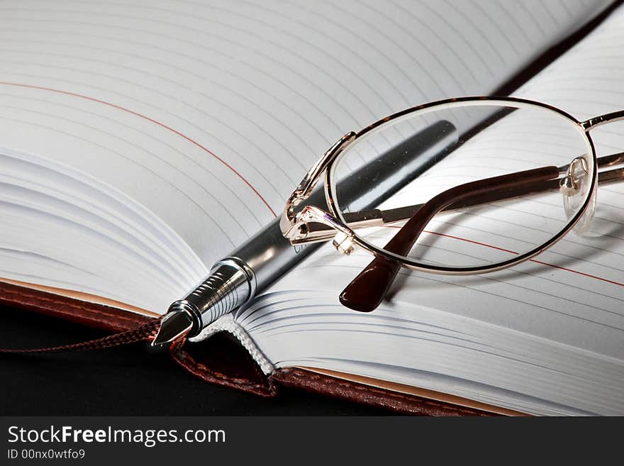 An image of pen and glass