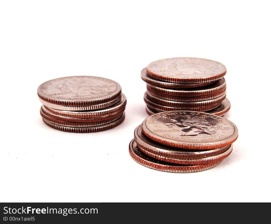 Three stacks of quarters on a surface. Three stacks of quarters on a surface.