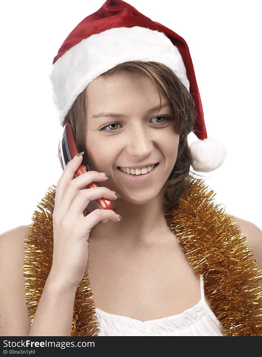 Girl in santa's hat with mobile phone. Girl in santa's hat with mobile phone