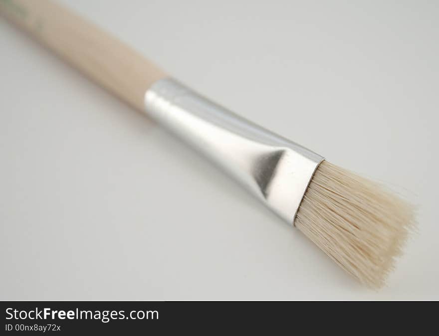 Close - up of paint brush isolated on white.