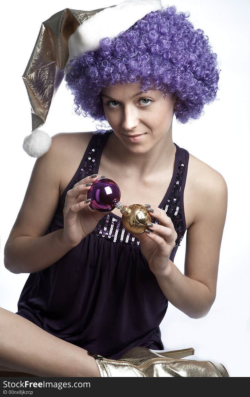 Girl in santa's hat and purple wig. Girl in santa's hat and purple wig