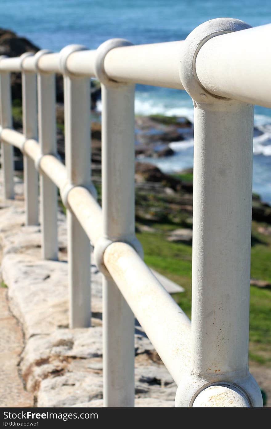 White hand rail at the beach 2