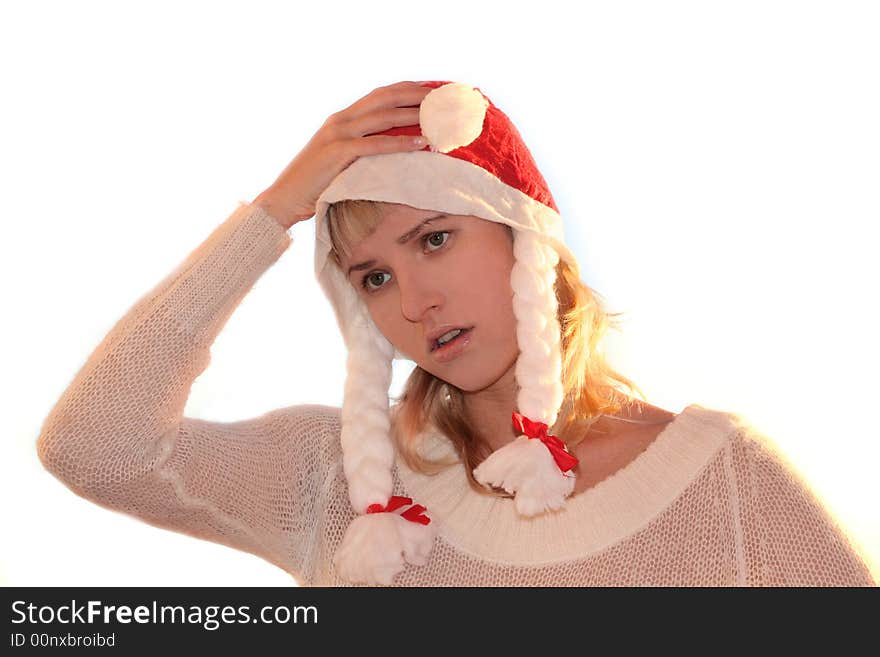 Young woman in cap of Santa thinking about New Year