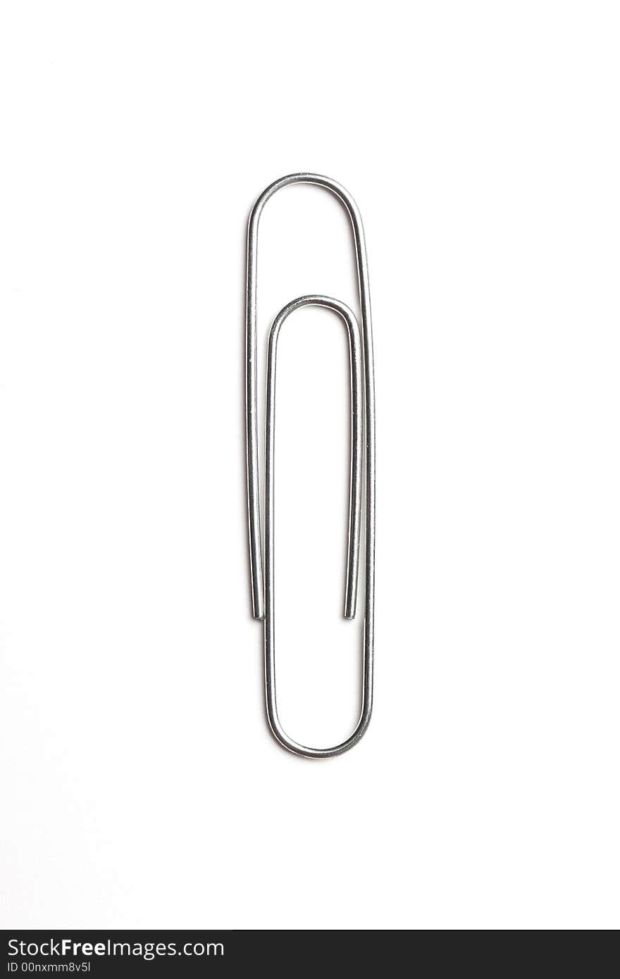 Metal paper clip isolated on white background