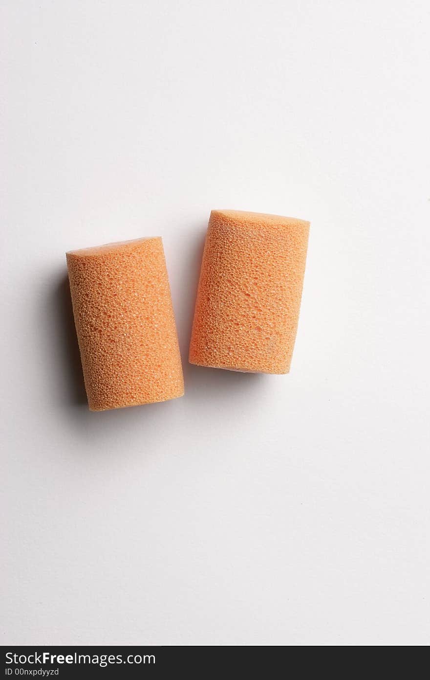 Two foam earplugs isolated on white background