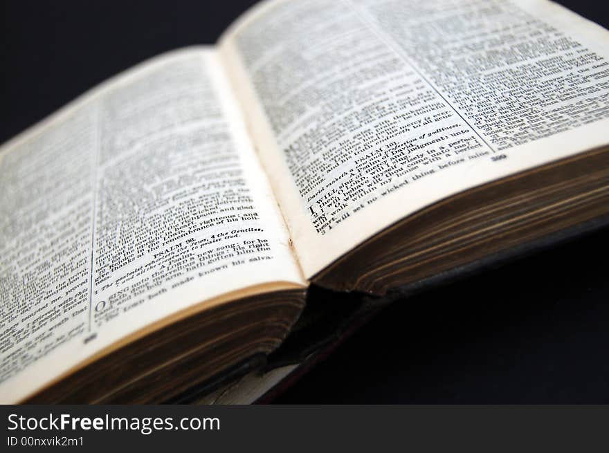 Closeup of old looking book on dark background. Closeup of old looking book on dark background