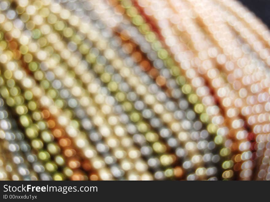 Blurred colorful freshwater pearl strands. Blurred colorful freshwater pearl strands