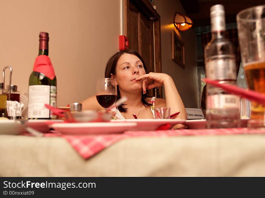 The girl is having diner in the restaurant. The girl is having diner in the restaurant