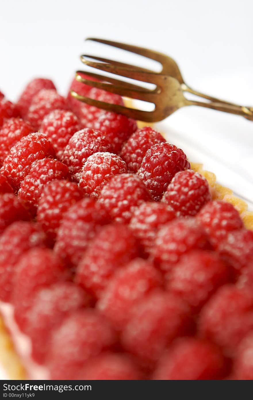 Raspberry tart with a fork