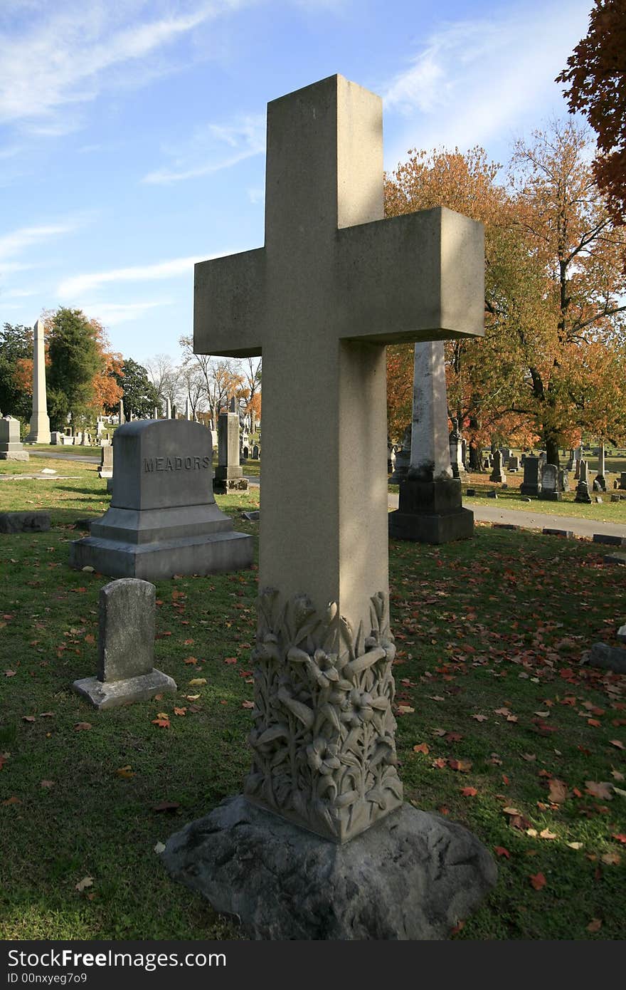 Stone Cross in a local graveyard, a sign of rembrence and hope. Stone Cross in a local graveyard, a sign of rembrence and hope