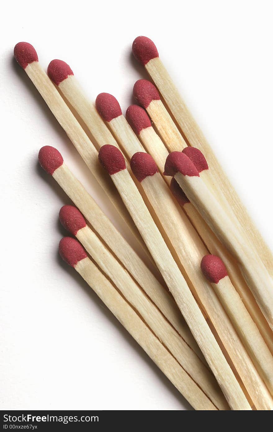 Wooden Matchsticks with red sulfur tips isolated on white background