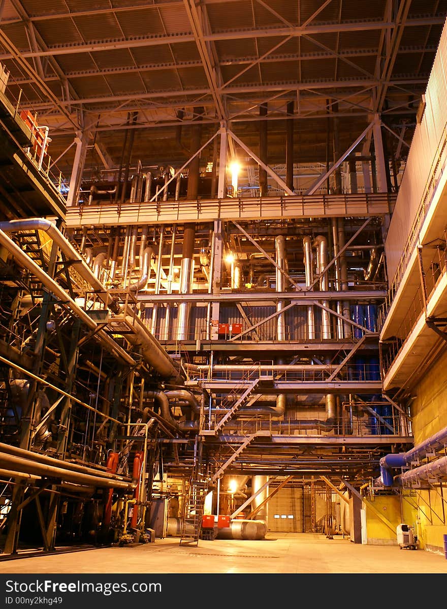 Equipment, cables and piping as found inside of a modern industrial power plant