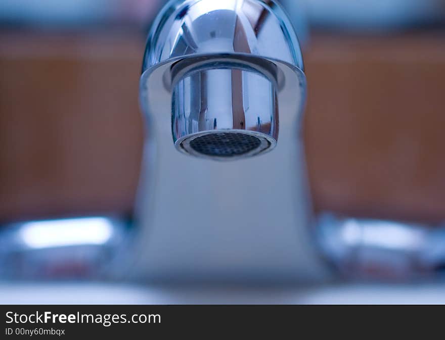 Close up on a shiny water faucet