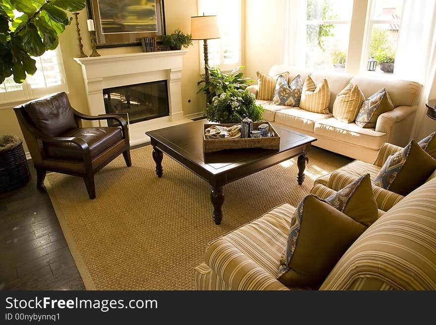 Living room with a fireplace and stylish decor. Living room with a fireplace and stylish decor.