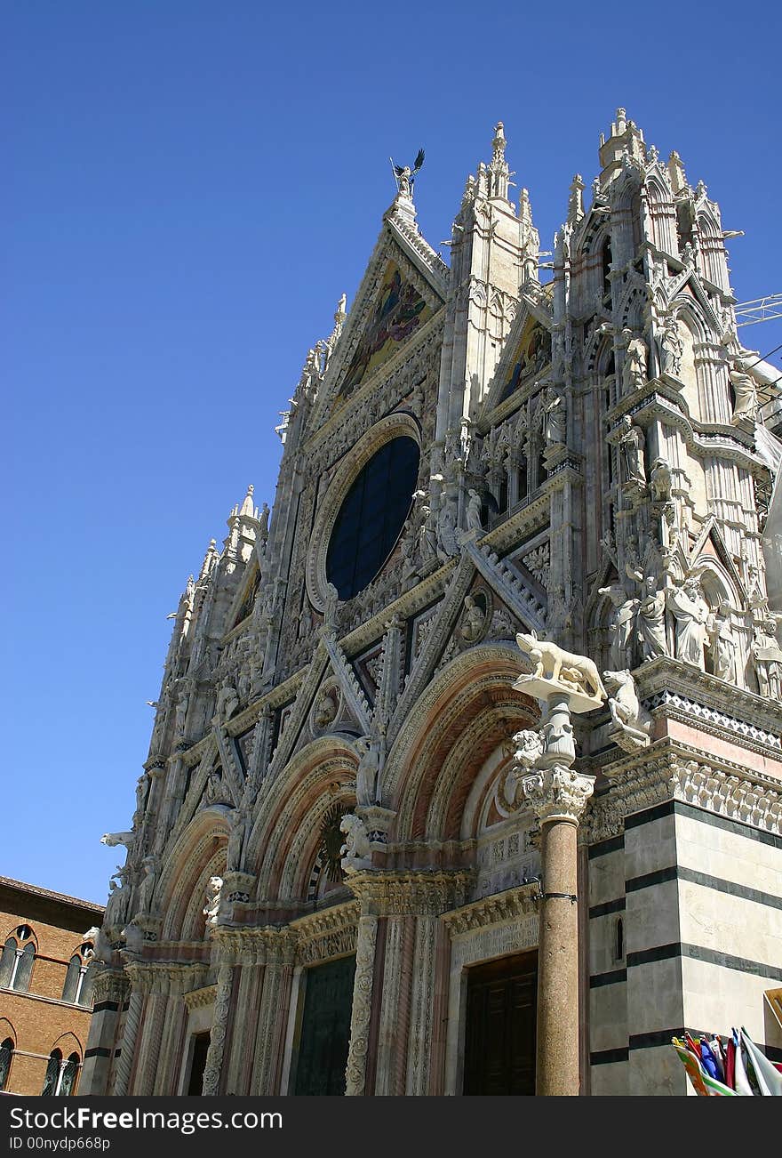 Architecture.  Beautiful buildings and Romulus and Remus Statue in Siena, Italy. Architecture.  Beautiful buildings and Romulus and Remus Statue in Siena, Italy