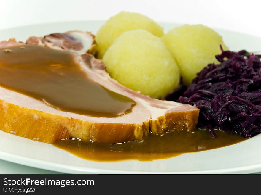 Dumpling with pork chop and red cabbage